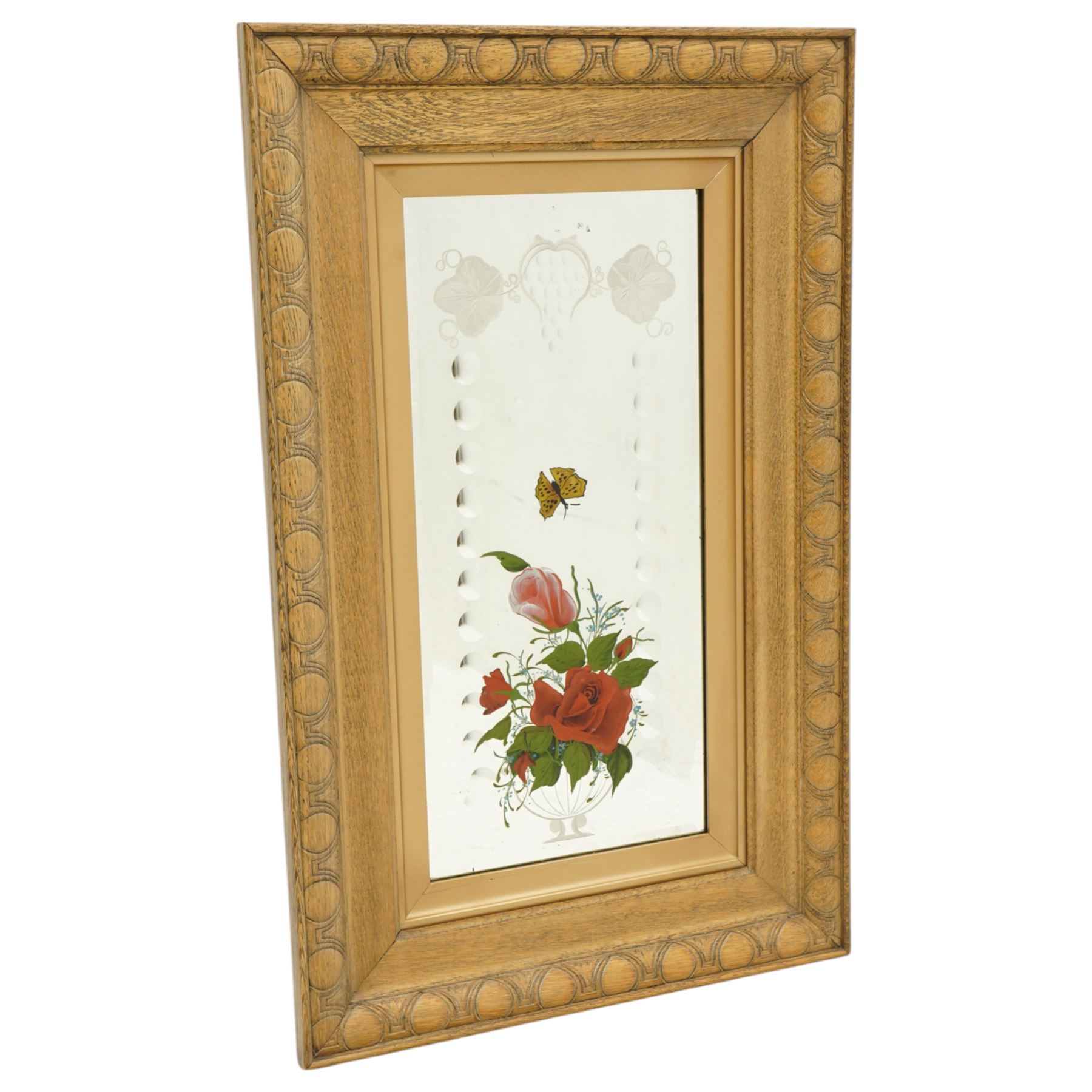 Set of eight early/mid 20th century oak framed 'Gypsy' mirrors, each of rectangular form, the mirror plates decorated with acid etched and cut fruiting vines and reverse painted flowering urns and butterflies, overall 82.5cm x 52cm