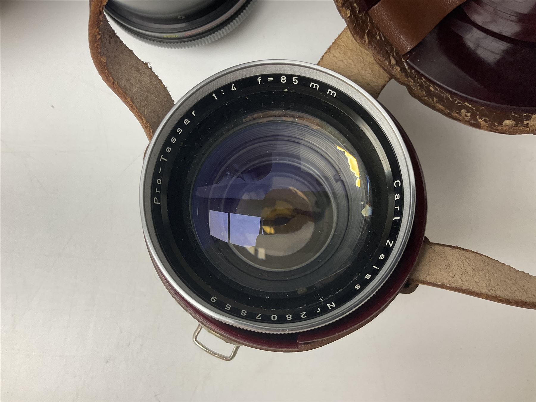 Four Zeiss Ikon camera bodies, to include, Contaflex Super B camera body, serial no. B31591, with 'Carl Zeiss Tessar 2.8/50 lens, serial no.3425553, Contaflex Super BC camera body, serial no. P81728, with 'Carl Zeiss Tessar 2.8/50' lens, serial no 4822280, etc, together with three cased lenses; 'Carl Zeiss Pro-Tessar 1:4 f=115mm' lens, serial no 3734740, 'Carl Zeiss Pr-Tessar 1:3.2 f=85mm' lens, serial no. 3647764 and 'Carl Zeiss Pr-Tessar 1:3.2 f=35mm' lens, and other Zeiss Ikon equipment 