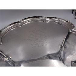 Mid 20th century silver tray, of hexagonal lobed form, with personal engraving to centre, upon three bracket feet, hallmarked William Comyns & Sons Ltd , London 1960, D34cm