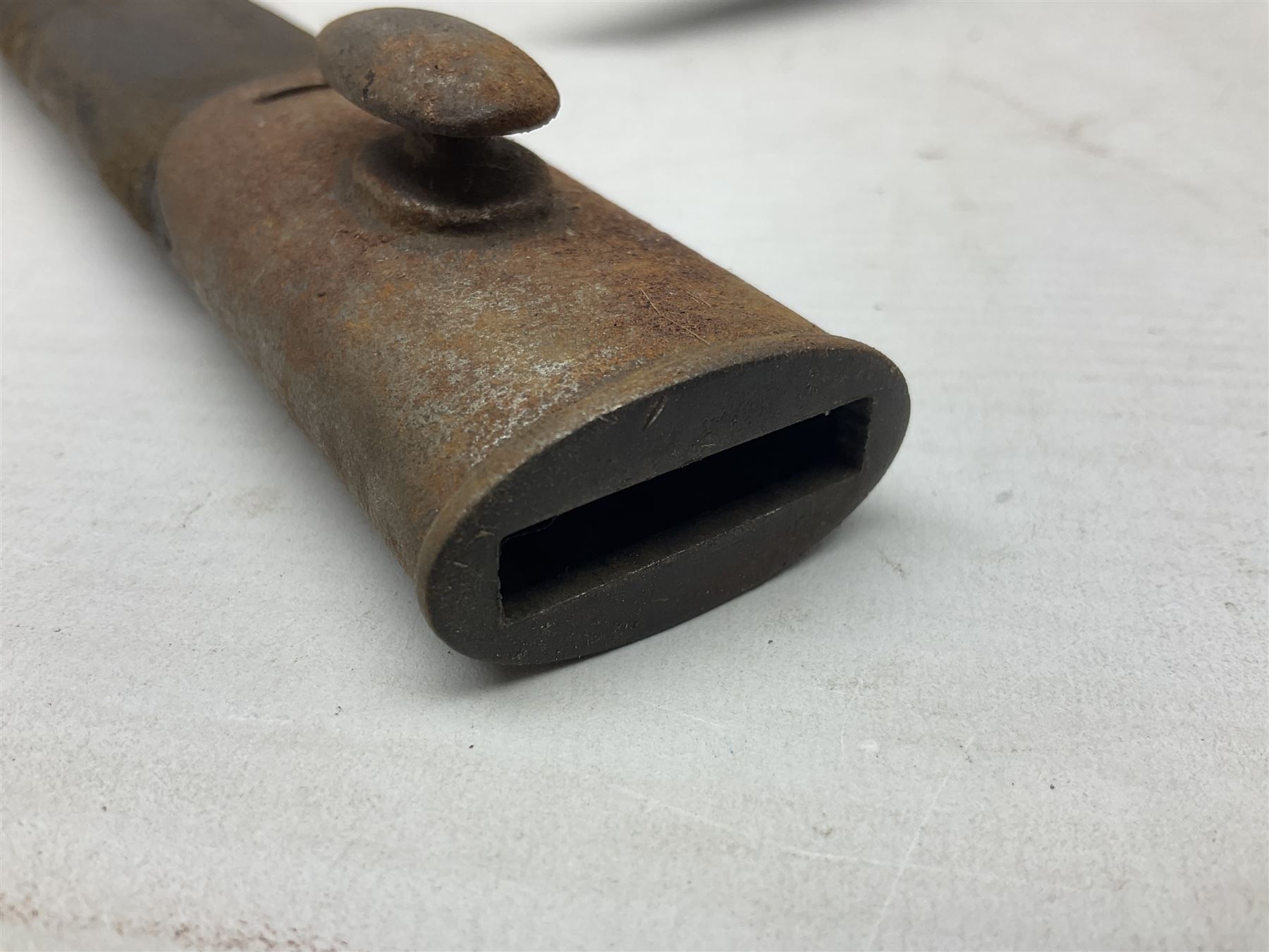 British No 7 MKI knife bayonet with 20cm single edged fullered clipped point blade;  blackened steel, large muzzle ring cross-guard; blackened swivelling pommel marked 'F5H'; red Tufnol composite grips; in blackened steel scabbard L33cm overall; British Pattern 1888 bayonet with scabbard; and German Ersatz bayonet with scabbard (3)