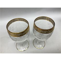 Set of twelve Moser style wine glasses, the bowls with etched floral bodies and gold banded rim with foliate decoration raised upon stem of twisted form, H14cm