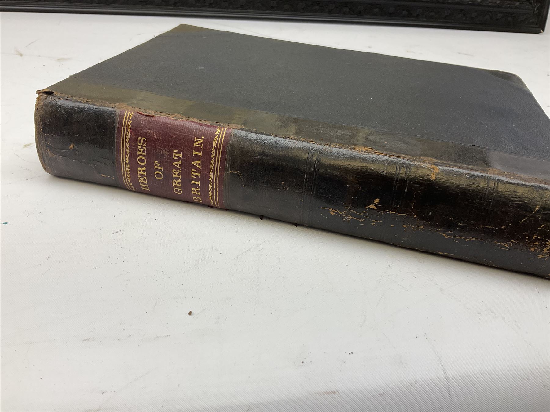 Payne (Harry) Artist: Victoria Cross Gallery; Complete set of twelve chromolithographic relief printed cards published by Birn Bros. (BB). Each: 120 x 155 mm; displayed together in an ebonised frame 54 x 82.5cm; together with the half leather bound reference book by Edwin Hodder entitled Heroes of Britain in Peace and War (2)
