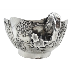  Chinese export silver bowl in the Japanese style circa 1900, decorated in relief with iris, chrysanthemum, egrets, humming birds and prunus blossom handles, beaten interior, signature panels and letters DETU  