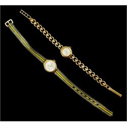 Two 9ct gold ladies manual wind wristwatches, one on integral 9ct gold bracelet, the other on a fabric strap
