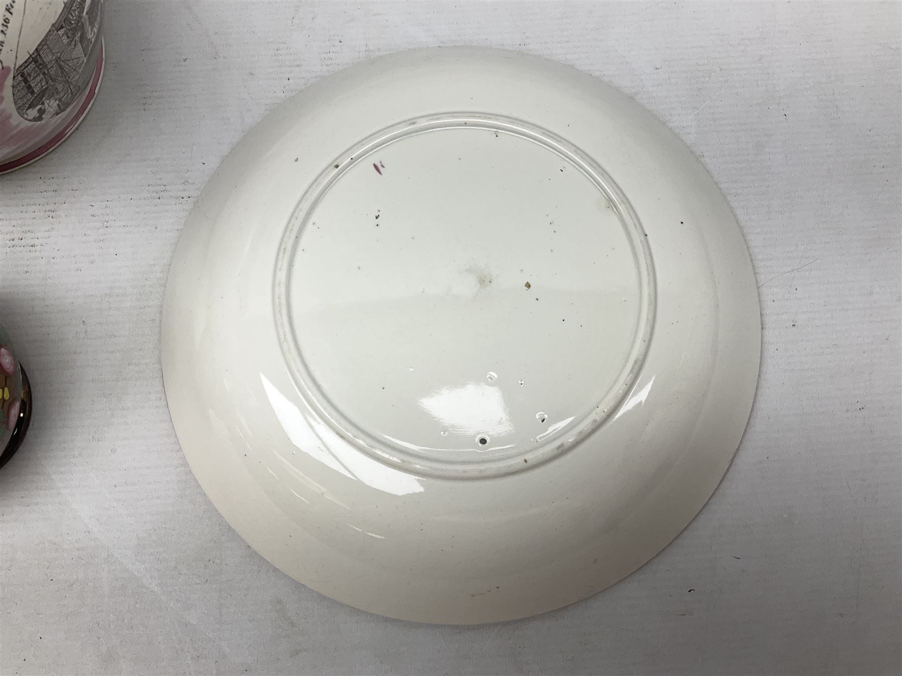 Early 20th century Sunderland lustre jug, decorated with transfer Masonic scene and poem 'The World is in Pain/Our Secrets to Gain/But Still Let Them Wonder and Gaze/The Never Can Divine/The World Nor The Sign/Of a Free and Accepted Mason', the reverse decorated with Sunderland River Wear cast iron bridge scene below text (a/f), together with a copper lustre jug, and pink lustre bowl, jug H20cm