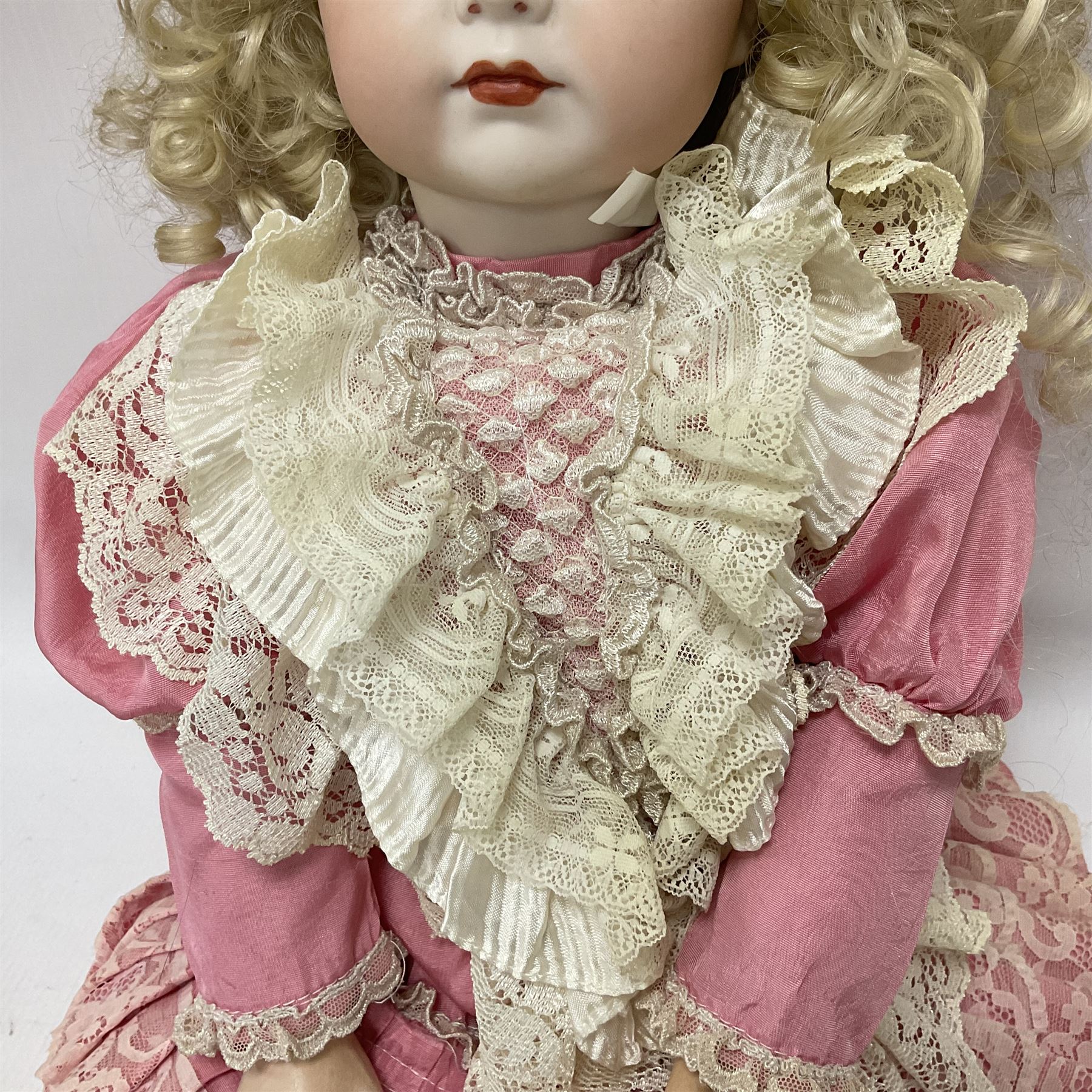Reproduction Simon & Halbig bisque head doll with applied hair and jointed limbs; marked Simon & Halbig 117, H58cm