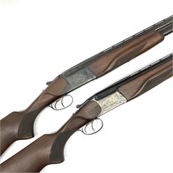 Two Russian Baikal 12-bore over-and-under double barrel boxlock non-ejector sporting guns; one with 68.5cm barrels, walnut stock with chequered pistol grip and fore-end and thumb safety, serial no.520545, L111cm overall; the other with 72.5cm barrels, walnut stock with chequered pistol grip and fore-end and thumb safety, serial no.012448, L114.5cm overall (2) SHOTGUN CERTIFICATE REQUIRED