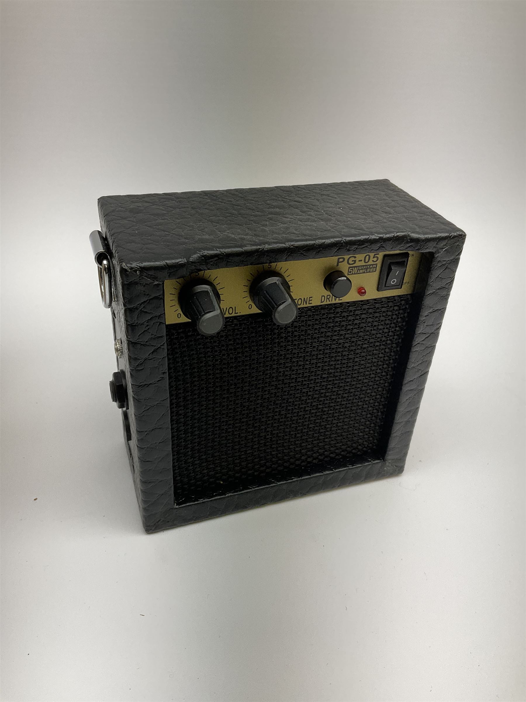 Modern Kala ukulele with acacia back and sides, spruce top and mahogany neck with slotted headstock No. KA-ABP-CTG 1801 L76cm in Tanglewood carrying case; and PG-05 Portable 5W Guitar Amplifier (Battery), boxed (2)