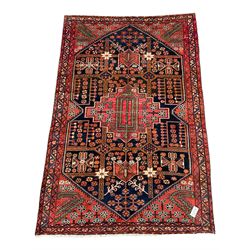 Persian Farahan rug, red and blue ground, the field divided into section with stylised flower head decoration, repeating border with overall floral design