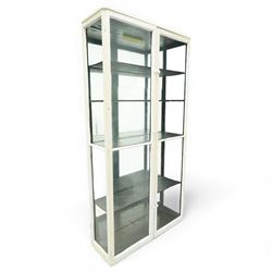 Late 19th century painted pine shop display cabinet, tall narrow form enclosed by twin gla...