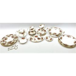 Royal Albert Old Country Roses part dinner and tea service comprising teapot, four tea cups and saucers, eight dessert plates, cake plate, cake stand, a tureen with cover, six dinner plates, an oval dish, two trinket dishes, bell and shoe decoration. 