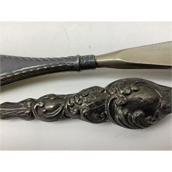Set of six silver handled butter knives, in case, pair of silver handled fish servers, two silver handled shoe horns, and two silver handled button hooks, all hallmarked or stamped Sterling