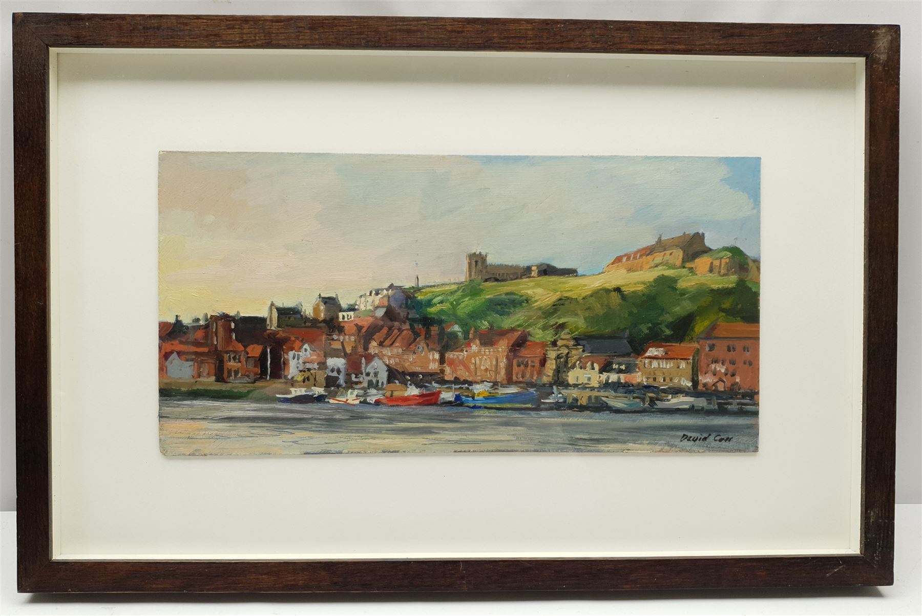 David James Carr (Northern British 1944-2009): Whitby East Cliff, oil on board signed 20cm x 40cm