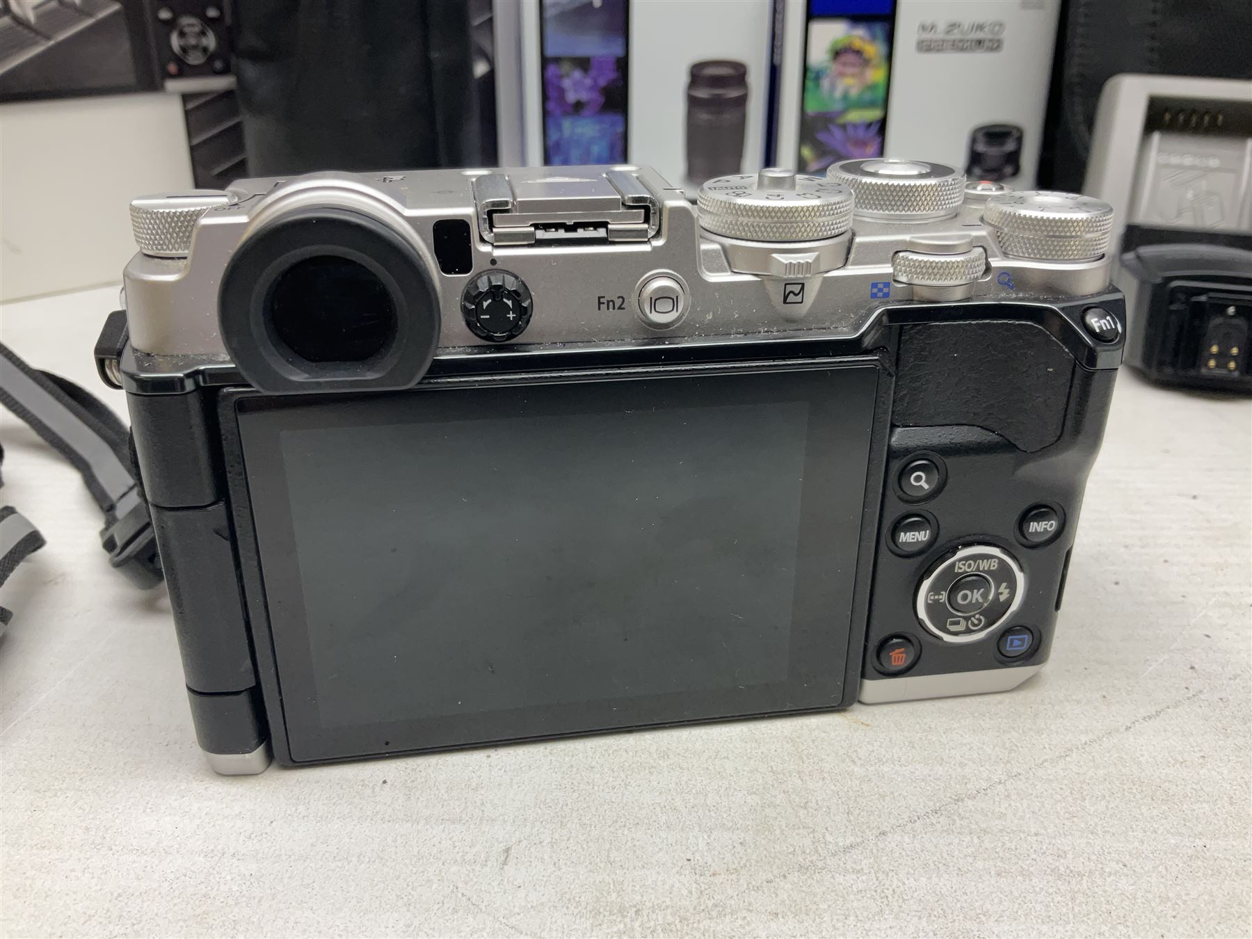 Olympus PEN-F camera body, with 'Olympus M- Zuiko Digital 25mm 1: 1.8' lens,  'Olympus M- Zuiko Digital 75-300mm 1: 4.8 - 6.7' lens and  'Olympus M- Zuiko Digital 17mm 1: 1.8' lens, with original box, together with Lowepro camera bag