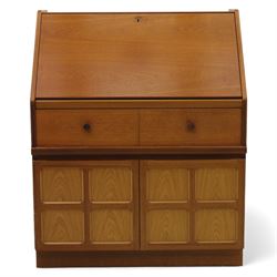 Parker Knoll - teak bureau, sloped fall front enclosing fitted interior, over two short drawers and two panelled cupboard doors