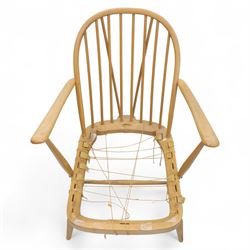 Ercol - Model '203', pair of easy chairs, with blue upholstered cushions and additional orange covers, with looped backrest and shaped spindles, outward swept arms, drop in seat frame