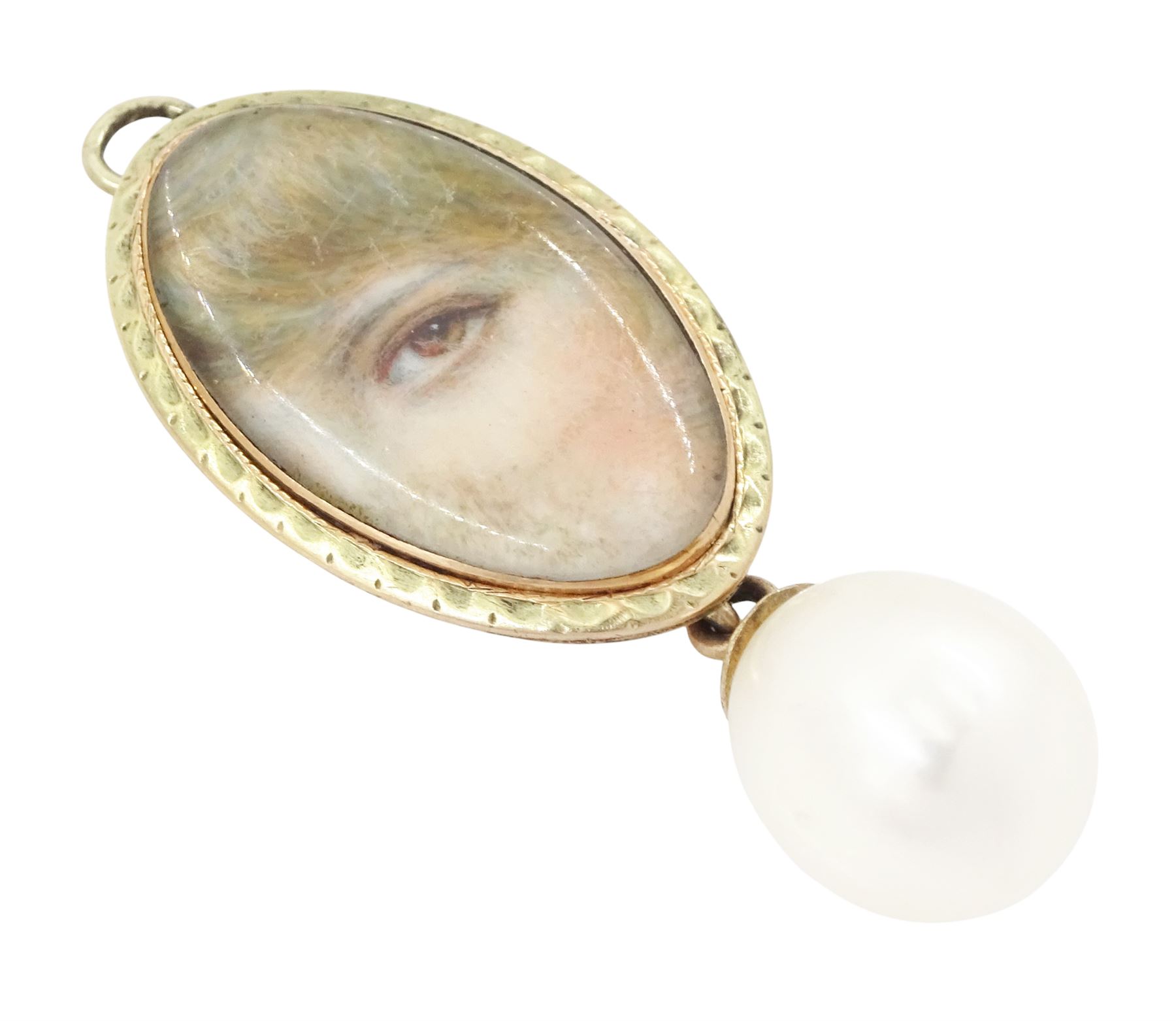 Georgian gold 'Lover's Eye' pendant, set with a lozenge shaped portrait miniature of a lady's eye on ivory, within a milled bezel and closed back, suspending a later cultured pearl drop. This lot has been registered for sale under Section 10 of the APHA Ivory Act