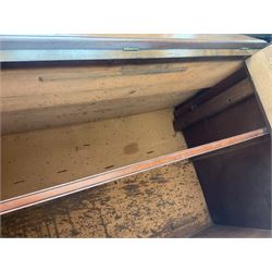 Early 19th century figured mahogany bureau bookcase, projecting splay moulded cornice over three adjustable shelves enclosed by two glazed doors, fall front revealing pigeonholes, cupboard and drawers, pull-out strays with scroll carved terminals, double cupboard with two panelled doors, on turned feet 