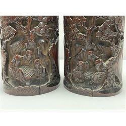 Pair of Chinese carved bamboo brush pots, decorated with figures in a pagoda landscape, H19cm
