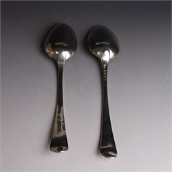 George II silver Old English pattern table spoon, with engraved initial W to terminal, hallmarked Thomas Northcote, London, probably 1758 date mark worn, together with a George III Old English pattern table spoon with bright cut decoration and engraved initials, hallmarked London 1783, makers mark TE probably for Thomas Evans