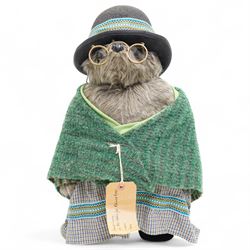Gabrielle Designs Paddington Bear 'Aunt Lucy', 1978, dressed in green shawl, with hat and spectacles, tartan dress and luggage tag from the Peruvian Rugby FC Reserves Supporters Club, H50cm