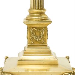 Late Victorian Neoclassical brass standard lamp with shade, the composite Ionic and Corinthian acanthus capital over a reeded column, terminating to a stepped platform base with applied festoon ornament, raised on four scrolling ball-and-claw feet
