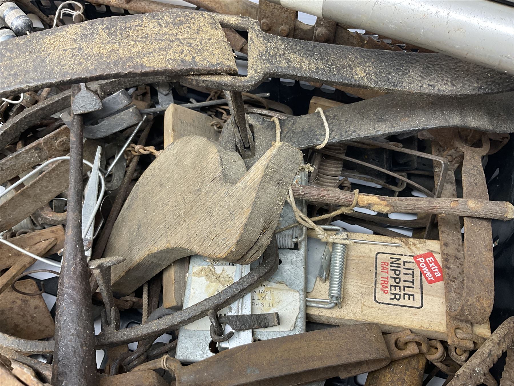 Quantity of animal traps including, gin traps, eel spears, Young's sparrow trap etc, Auctioneer's Note: These traps are sold as artefacts for ornamental purposes only as the use of some of them may be illegal
