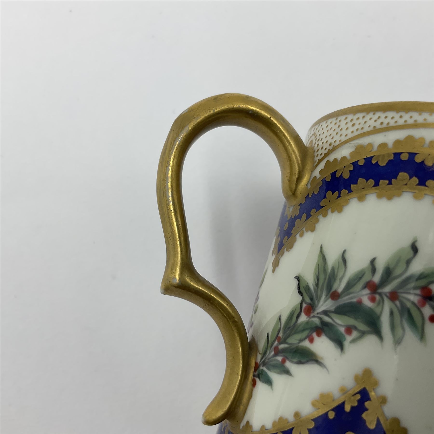 Sèvres soft paste porcelain coffee can and saucer with date code for 1767, painted with floral and laurel leaf garlands within blue scalloped and gilt borders, interlaced LL monogram enclosing the date letter O above painters mark for Catrice, coffee can H7.5cm, saucer D15cm