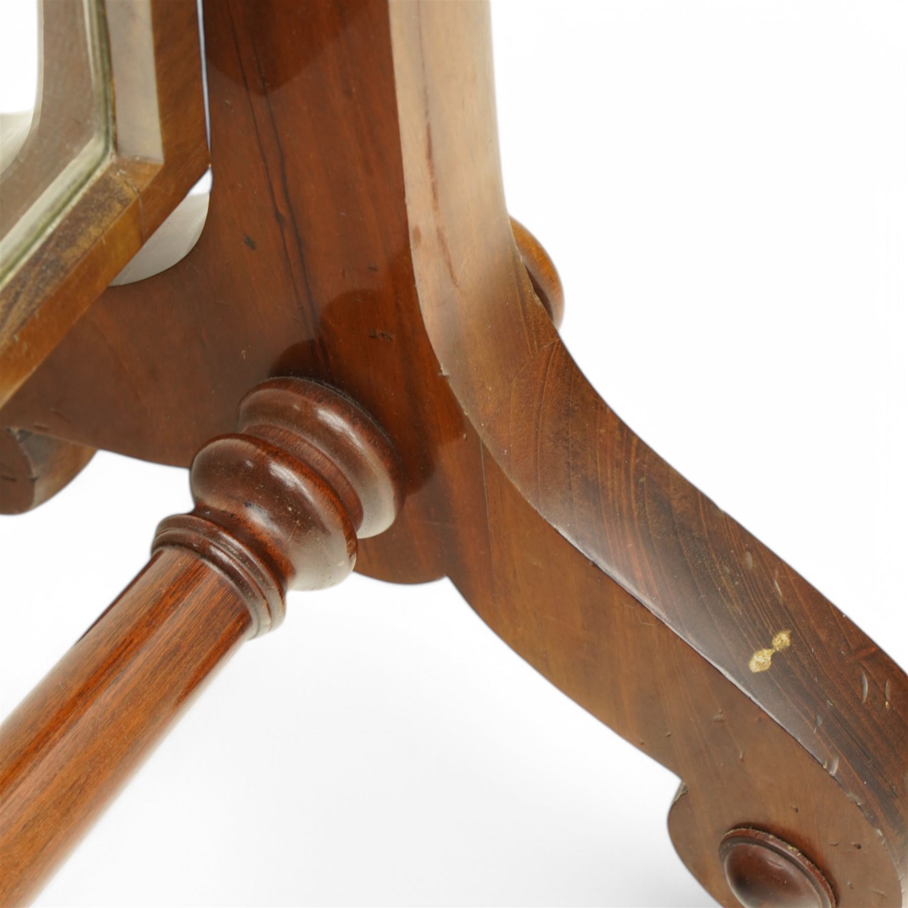 Early 19th century mahogany cheval dressing mirror, plain mirror plate within chamfered frame with arched top, on rolled horns and out-splayed rolled feet, united by turned stretcher 