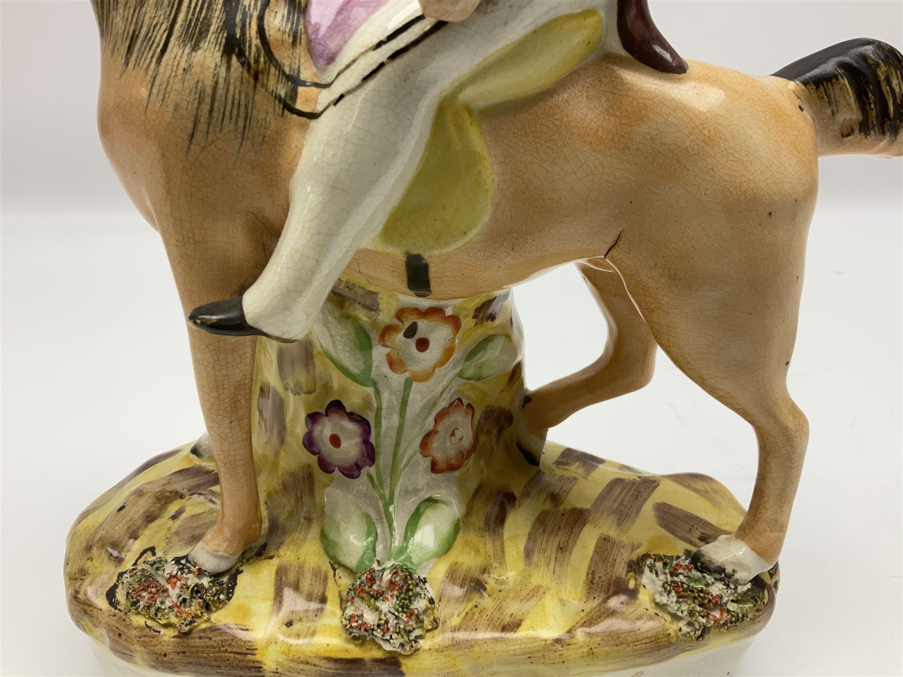 19th century Staffordshire figure of Robert Peel, titled 'Sir Robert Peel', modelled on horseback, atop an oval plinth base featuring a naturalistic and floral design, H30cm 