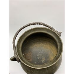 17th century bronze cauldron, probably German or Austrian, of bellied form with twin angular handles supporting a twisted handle, upon three splayed zoomorphic bearded mask feet, not including handle H30cm, rim D22cm