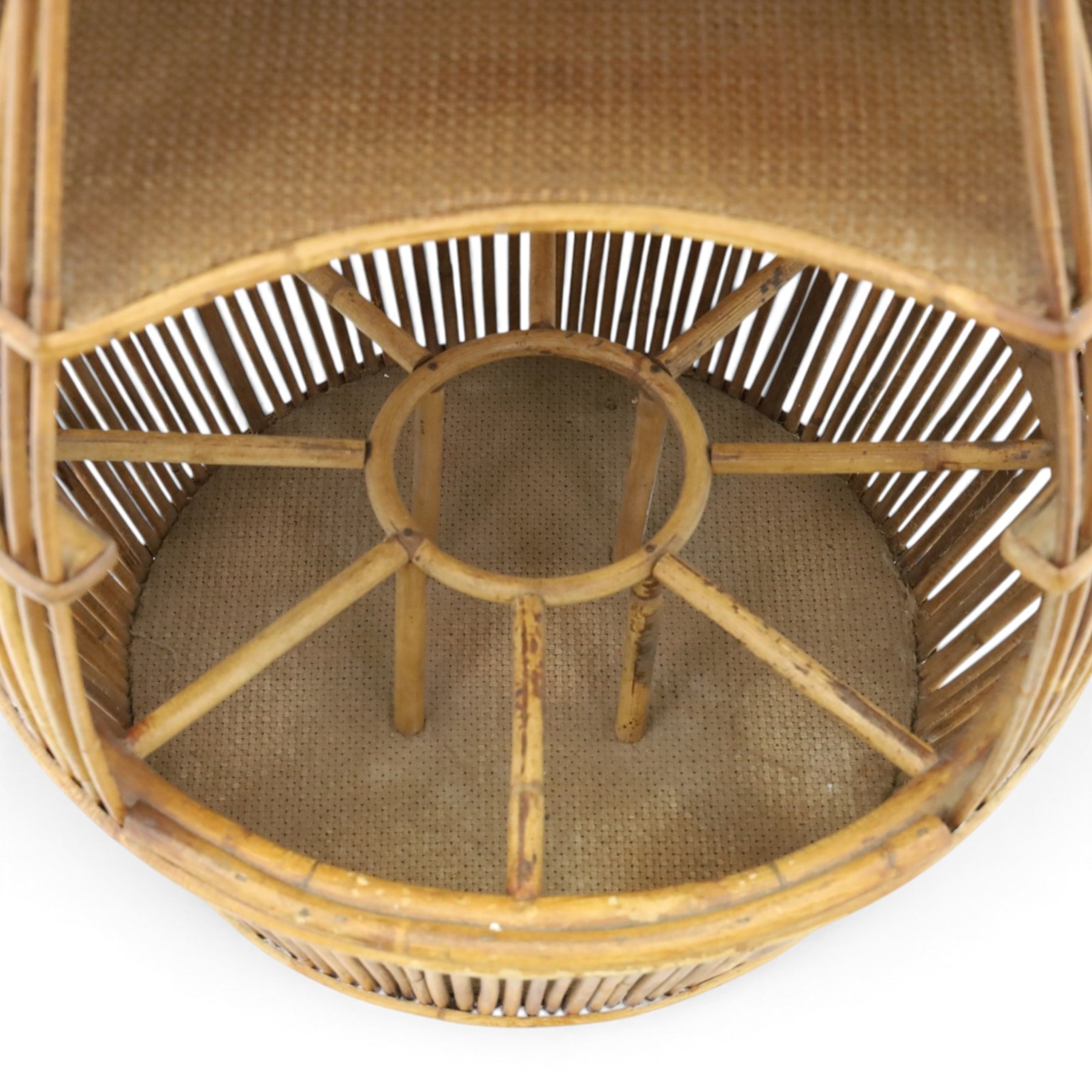 Italian mid-20th century barrel-shaped bar cart in rattan and bamboo, the circular top with rattan and bamboo handle, above a rattan shelf with bamboo bottle dividers below, raised on castors