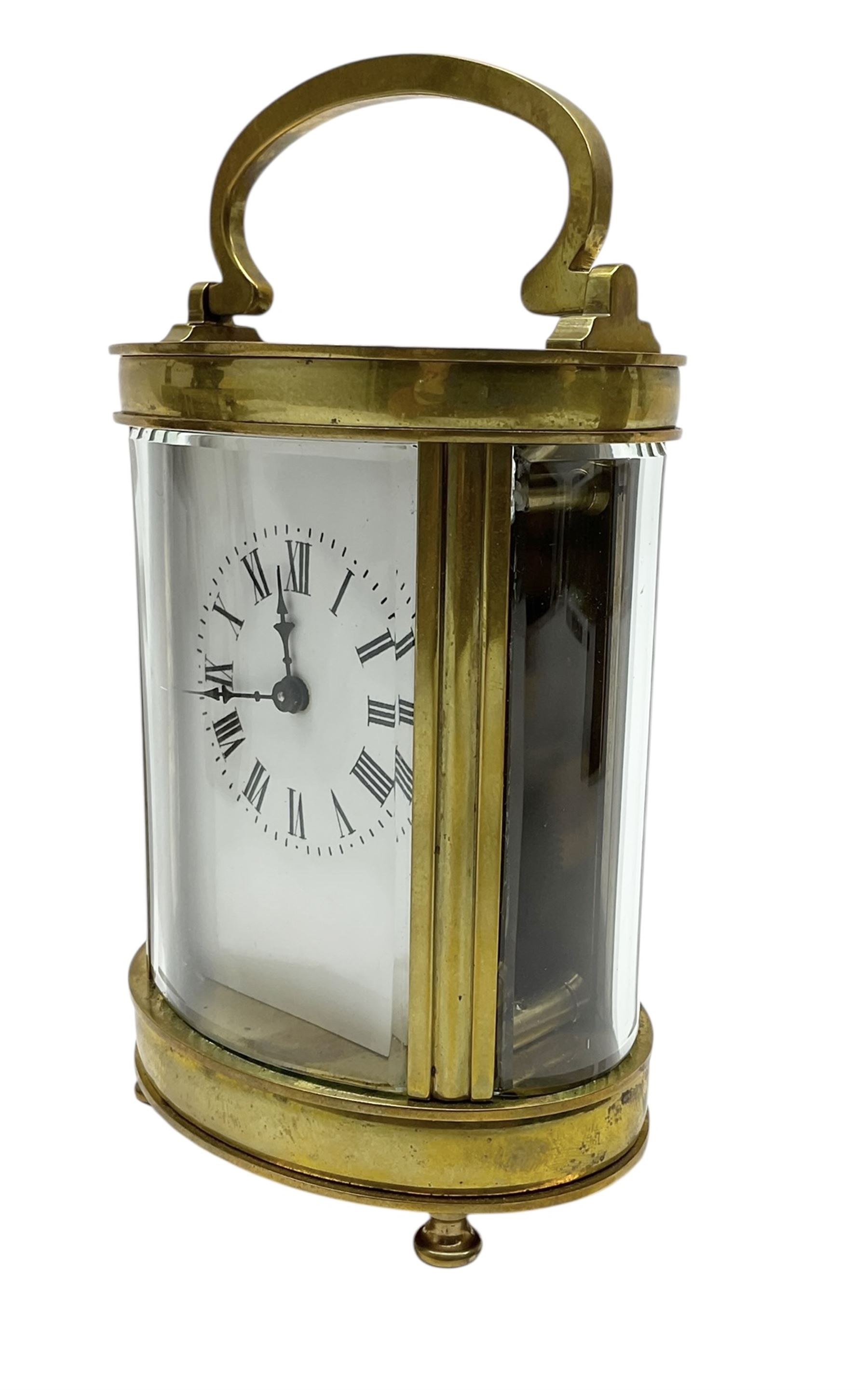 Two French early 20th century timepiece carriage clocks and a traveling case, both clocks with enamel dials, Roman numerals and steel hands, both with cylinder platform escapements.