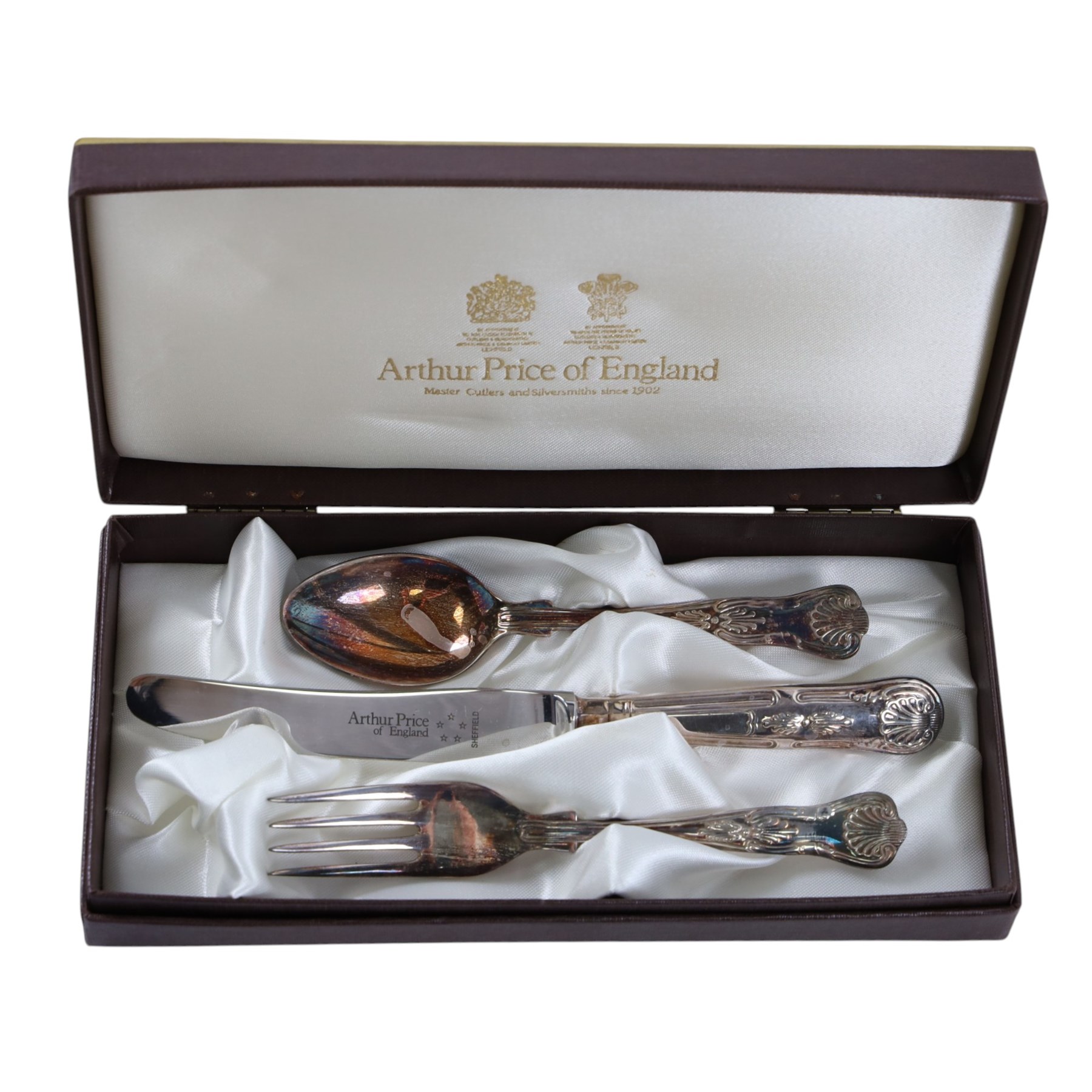 Silver dessert spoon, silver souvenir spoon, silver handled fish knife and two silver napkin rings, together with a collection of silver plated cutlery
