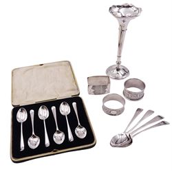 Group of silver, comprising set of six 1920's coffee spoons with rat tail bowls, hallmarked E M Dickinson, Sheffield 1926, contained within a fitted case, three napkin rings, including a Victorian example of rectangular form with engine turned decoration, hallmarked Collett & Anderson, London 1933, three George III Old English pattern teaspoons, three examples with bright cut decoration, and an early 20th century silver specimen vase with filled base, approximate total weighable silver 4.47 ozt (138.9 grams)