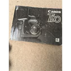 Canon T90 camera and a Kodak EK 160-EF camera