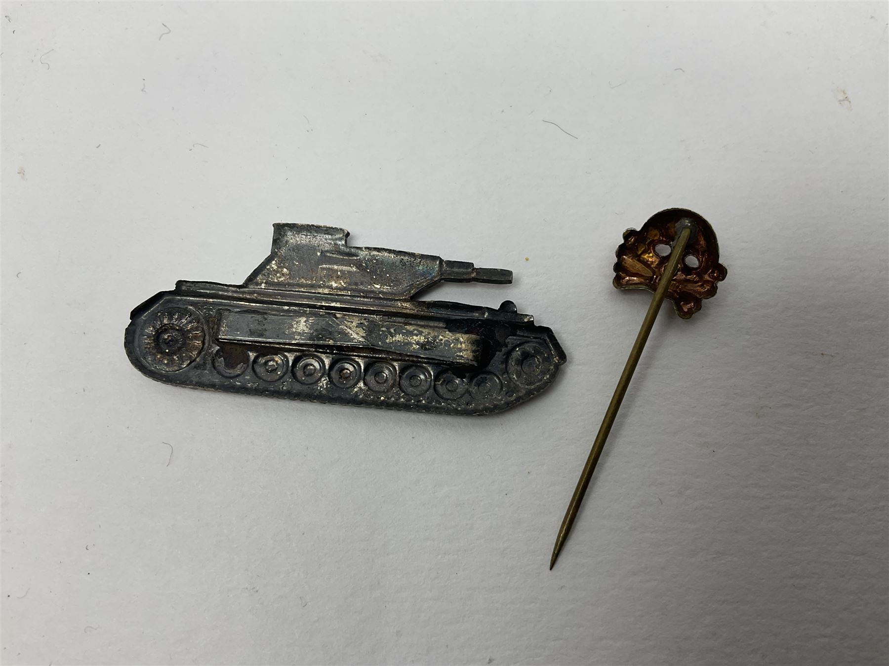 Collection of eleven German metal and cloth badges and uniform buttons including driver's badge, two 'SS' fabric skulls, private's shoulder tabs, Police cloth badge, tank destruction badge, medal bars and ribbon etc; most WW2 period