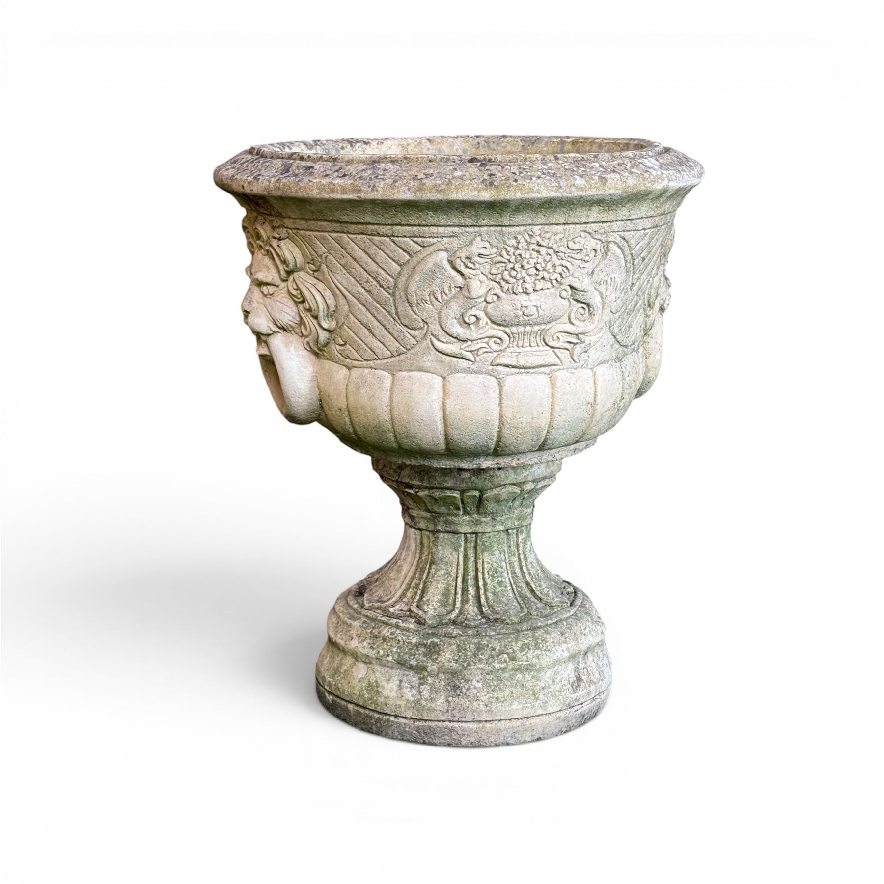 Pair of classic design cast stone garden urns, circular bowl detailed with lion mask loop handles