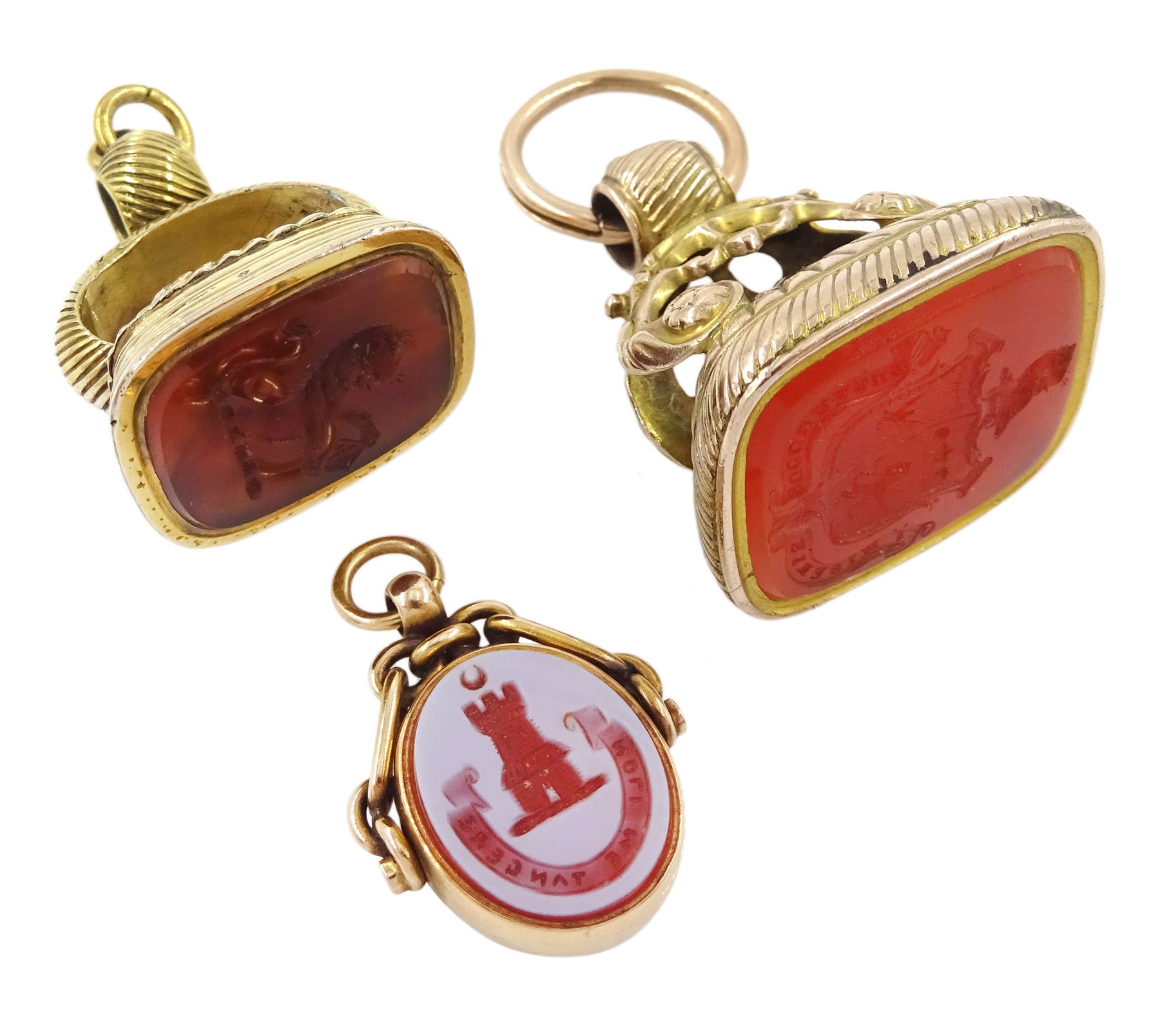 Victorian 15ct gold swivel fob, the agate intaglio depicting a crescent moon above a castle and inscribed 'Noli Me Tangere', the reverse bloodstone monogrammed 'MG', Birmingham, 1890 and two gold-plated carnelian and agate intaglio fobs, all with wax seal impressions
