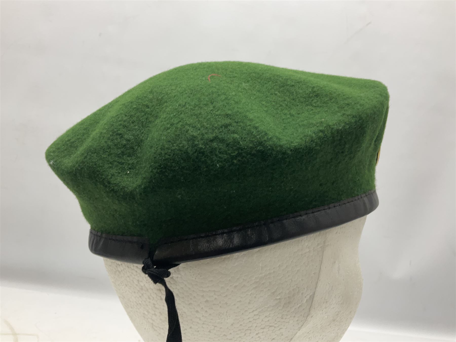 Four paratrooper berets - Russian, Italian, British and Foreign Legion; all with badges (4)