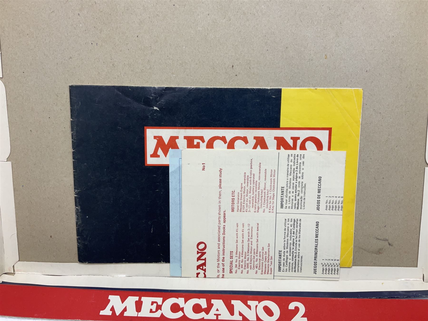Meccano - Outfits 2, 3 & 4 with blue and yellow parts; look to be virtually complete with most apertures filled; together with a partially stocked Meccano Elekrikit; all boxed with instruction manuals (4)