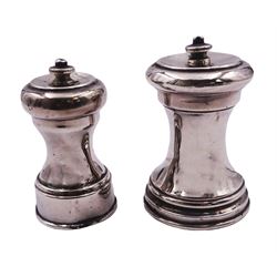 Two silver pepper grinders, each of typical waisted form, the larger Edwardian example hallmarked William Aitken, Chester 1901, H9cm, the smaller later example hallmarked J B Chatterley & Sons Ltd, London 1932, H8cm