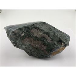 Amethyst crystal geode cluster, with well-defined crystals of various sizes, upon a carved wooden stand, H12cm, L20cm