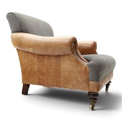 Tetrad - 'Taransay' Harris Tweed and tan leather club armchair, Howard shape with reclined back over deep seat and rolled arms with studwork, raised on turned front supports with castors, the sides and arms upholstered in tan leather with seat and back in herringbone-stitched Harris Tweed