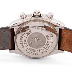 Breitling Chrono Cockpit gentleman's stainless steel diamond set automatic wristwatch, Ref. A13357, serial No. 2084732, cream dial with Roman numeral hour markers and date aperture, diamond set unidirectional rotating bezel, on Breitling brown leather strap, with fold-over clasp