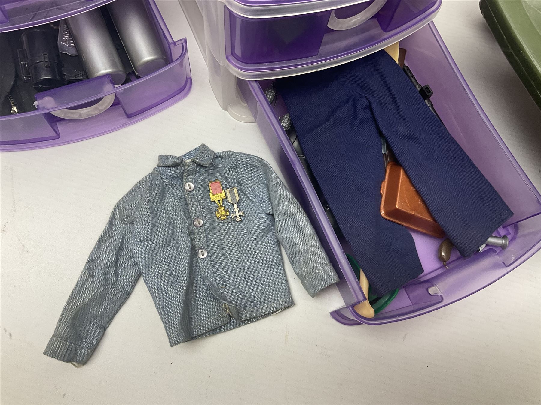 Action Man - five figures marked on the back 'Made in England by Palitoy under licence from Hasbro 1964', one dressed as a German Stormtrooper, one as a Red Devil Pilot and three in army uniform; another similar action figure marked to the right buttock ' G.I. Joe Copyright 1964 by Hasbro Patent Pending Made in Canada' dressed in army uniform; together with an Action Man jeep, field gun, mortar and machine guns and other accessories including helmets and weapons, parachute, diving equipment, skis and snow shoes, boots, uniforms etc; all unboxed