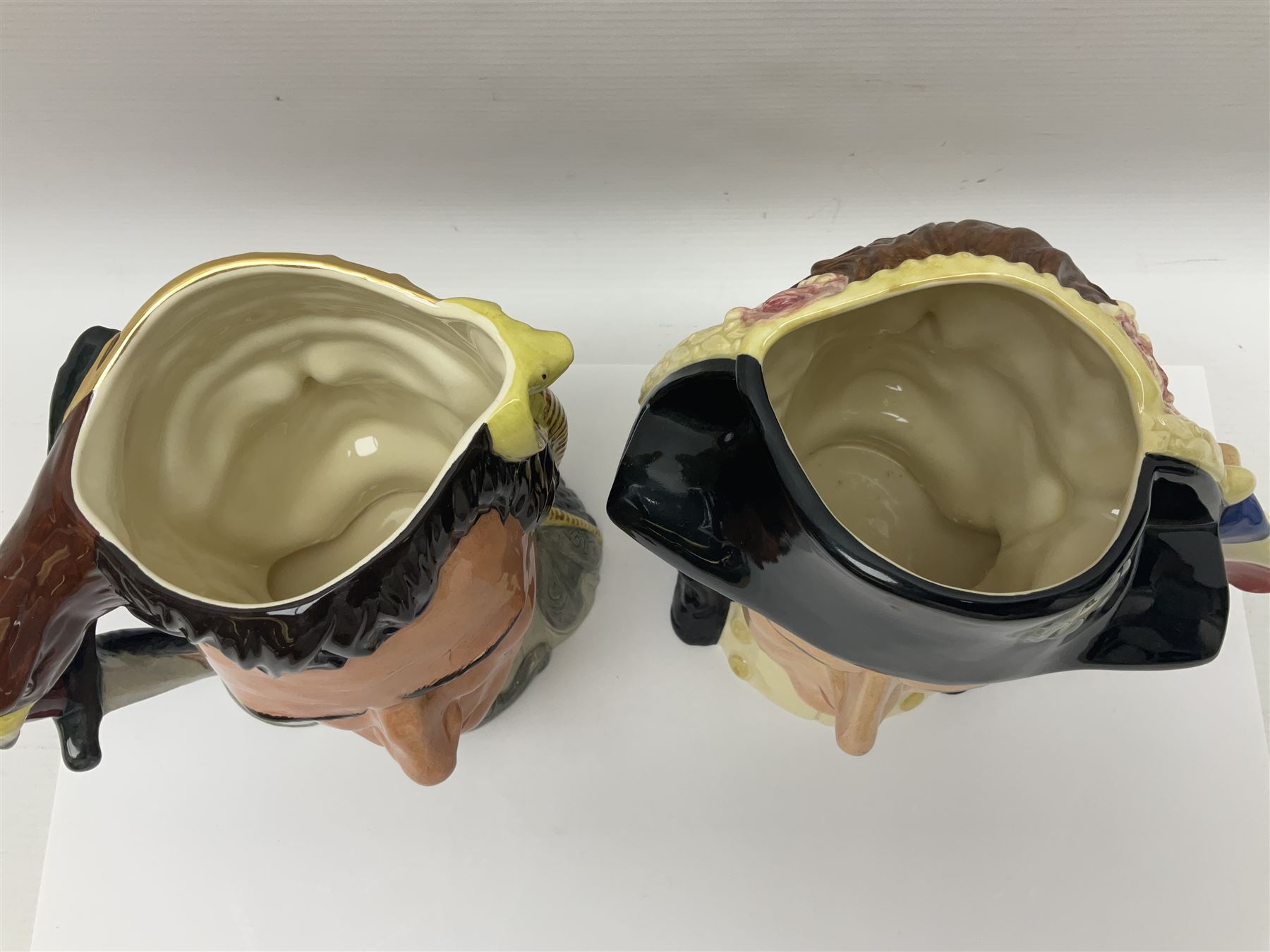 Royal Doulton two character jugs from the Star Crossed Lovers Collection, Antony & Cleopatra D6728 and Napoleon & Josephine D6750, together with two Royal Doulton Figures Micawber and Sairey Gamp