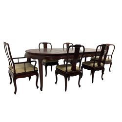 Mid to late 20th century Chinese hardwood extending dining table, two additional leaves, shaped apron carved with foliate scrolls, leaf carved cabriole supports (W246cm, H78cm, D117cm), and set six (4+2) dining chairs with shaped cresting rails over carved splats