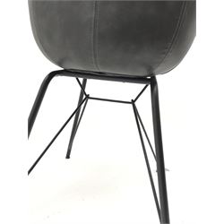 Bucket chair upholstered in stone grey fabric on outsplayed supports