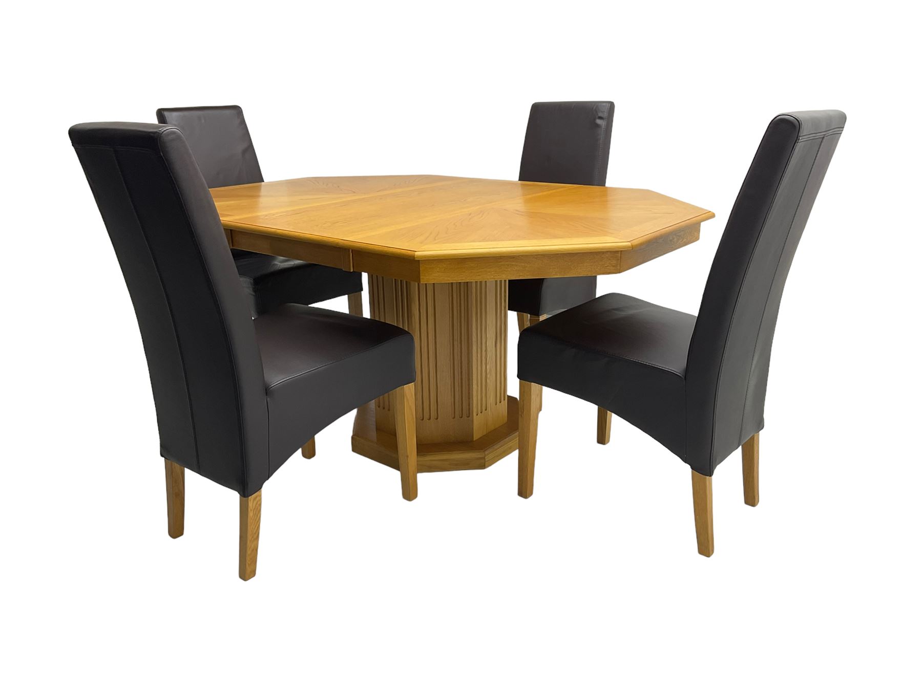 Oak octagonal extending dining table with additional leaf, octagonal pedestal base with fluting (150cm x 105cm x 76cm), and set four high back dining chairs upholstered in chocolate brown faux leather on square tapering supports (47cm x 54cm x 102cm)